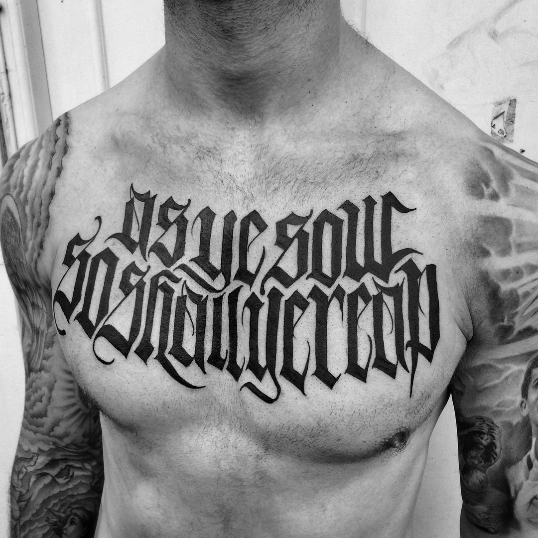 chest tattoo - freehand for Ryan done at Cross The Line Tattoo Studio in London - black neogoth letters reading AS YE SOW SO SHALL YE REAP
